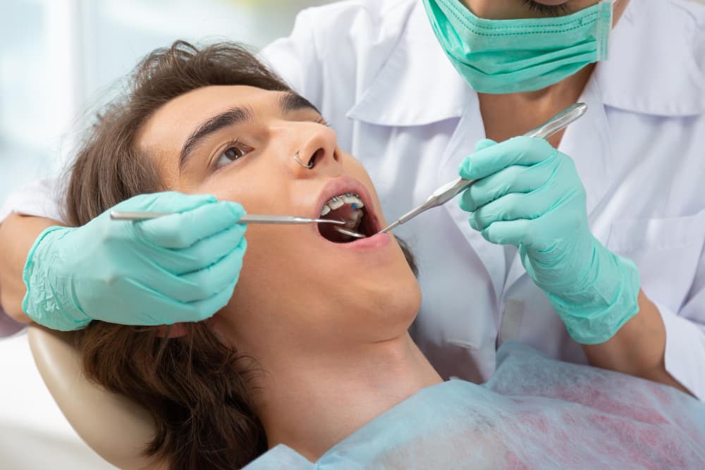The Hidden Enemy: How Plaque Turns to Tartar and Why Your Six-Month Cleanings Matter
